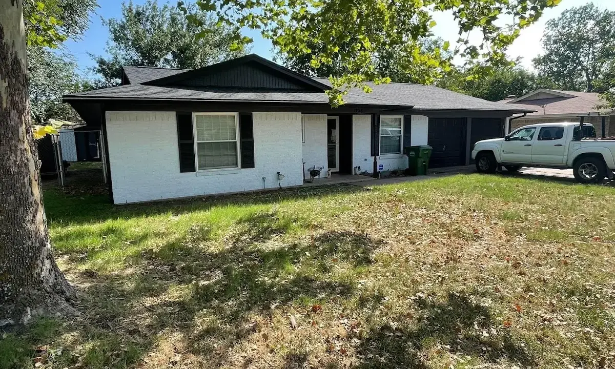Professional roofing crew working on a residential roof in Northgate